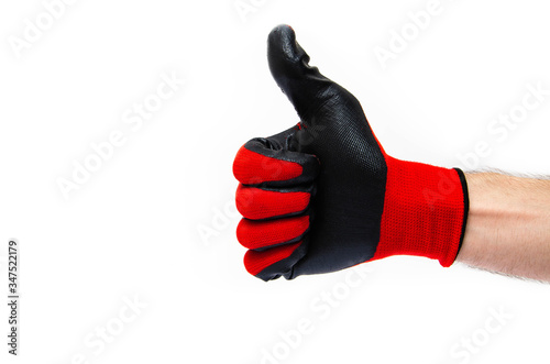 Gloves for workers, construction red with black rubber coating. Black-red gloves. Hand in gloves on a white background shows a thumbs up,  like