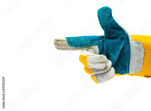 Men's construction gloves from a dense, strong fabric on a white background. Hand in glove shows, indicates, demonstrates with index . finger photo