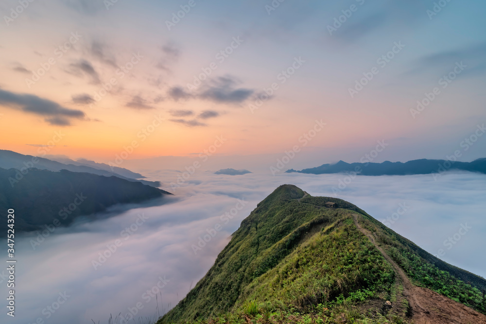 Ta Xua is a famous mountain range in northern Vietnam. All year round, the mountain rises above the clouds creating cloud inversions. Ta Xua is a famous mountain range in northern Vietnam. All year round, the mountain rises above the clouds creating cloud inversions.