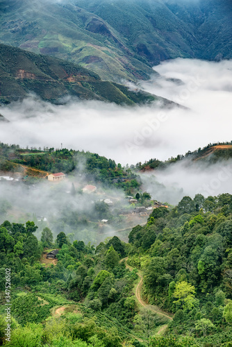 Ta Xua is a famous mountain range in northern Vietnam. All year round, the mountain rises above the clouds creating cloud inversions. photo