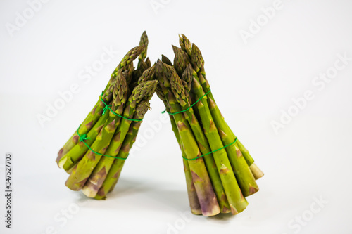 green asparagus on white background, fresh asparagus photo