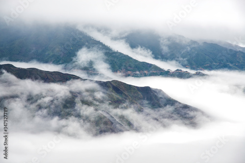 Ta Xua is a famous mountain range in northern Vietnam. All year round, the mountain rises above the clouds creating cloud inversions. photo
