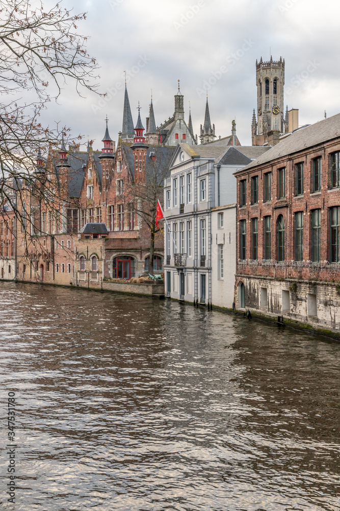 Buildings around channels and towers in Bruges
