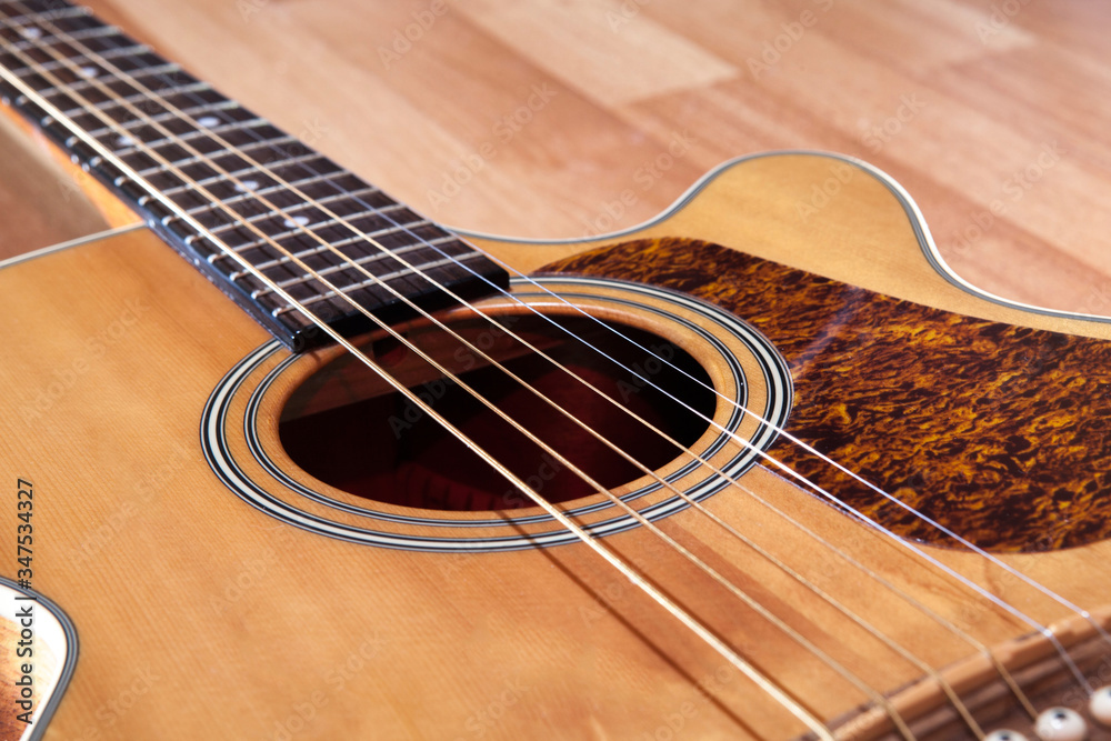Close up of brown wooden classical guitar Close up of brown wooden classical guitar
