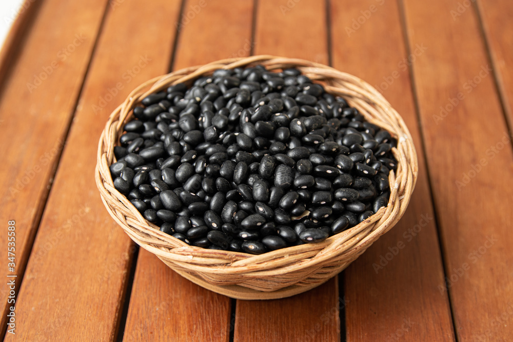 Pile of raw Brazilian Black Beans in a bowl. Also know as 'Feijao' Pile of raw Brazilian Black Beans in a bowl. Also know as 'Feijao'