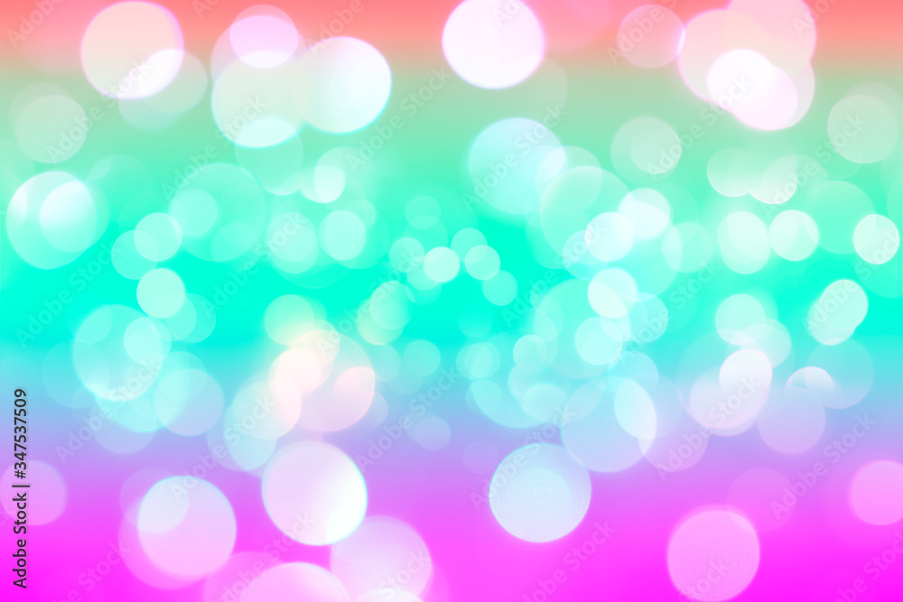 The white abstract bokeh on the colorful background.