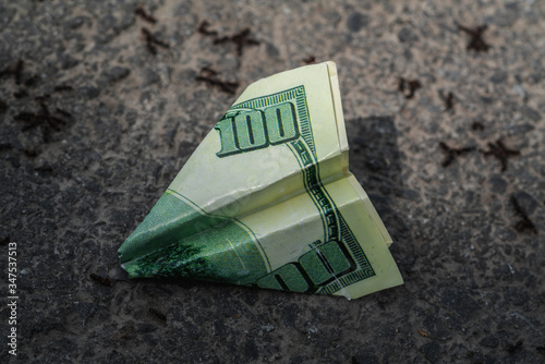 Obraz na płótnie US Dollar Airplane on the pavement with ants w salonie