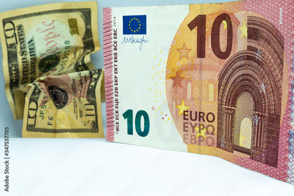 EURO Dominance at Dollar. Dollar and euro Bills on white background. American Dollar and european euro Cash Money. Dollar auro Banknotes. Cash euro bills EURO Dominance at Dollar. Dollar and euro Bills on white background. American Dollar and european euro Cash Money. Dollar auro Banknotes. Cash euro bills