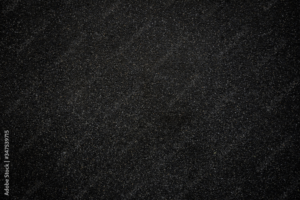 Black asphalt floor or road texture background. Black small stone floor texture background. Black asphalt floor or road texture background. Black small stone floor texture background.