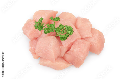 Fresh diced chicken fillet with parsley isolated on white background with clipping path and full depth of field. Top view. Flat lay