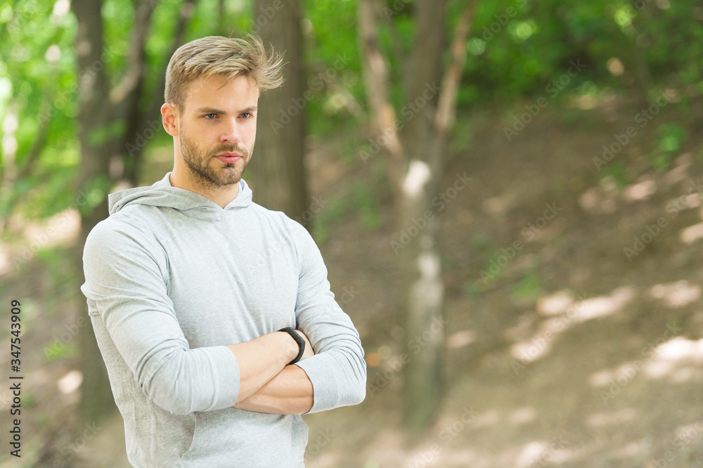 Make yourself proud. Sport goal and achievement. Totally ready. Sport challenge. Confident and physically strong. Athlete outdoors. Handsome man park nature background. Sport training and workout Make yourself proud. Sport goal and achievement. Totally ready. Sport challenge. Confident and physically strong. Athlete outdoors. Handsome man park nature background. Sport training and workout