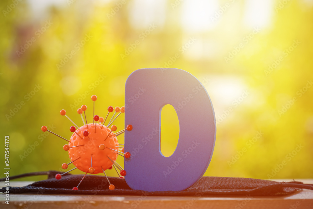 Vitamin D help in treating coronavirus. Vitamin D, coronavirus and question mark on a background of sunlight.