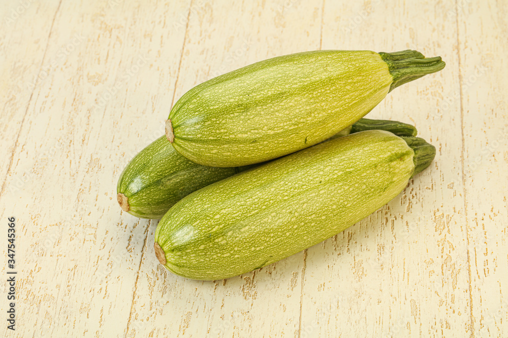 Young tasty zucchini over board Young tasty zucchini over board
