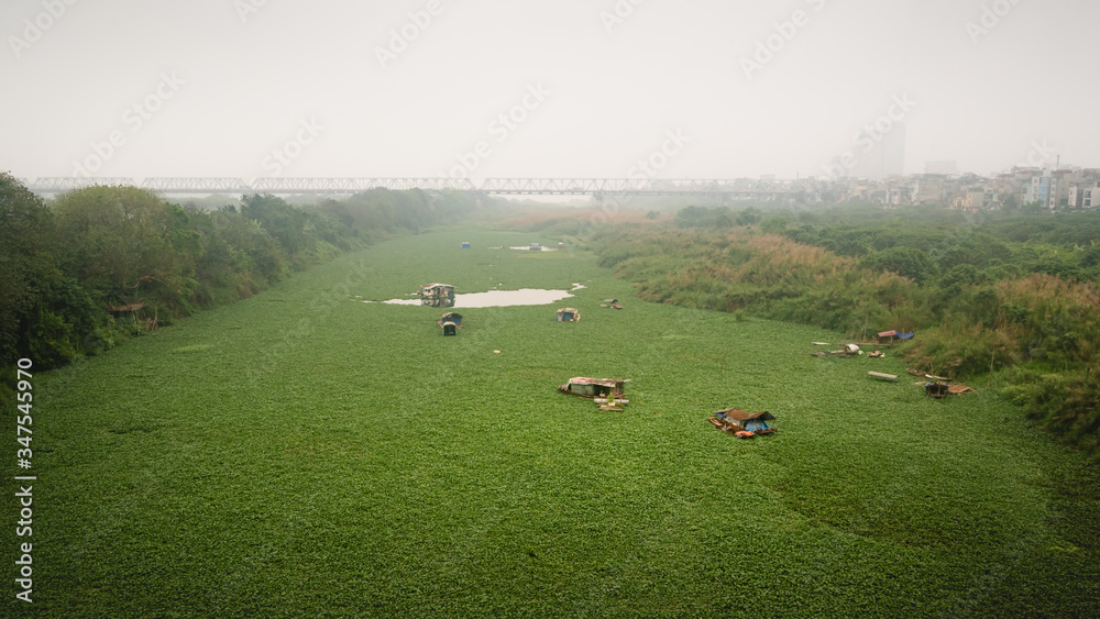 Old metal bridge and  farming field in Hanoi, Vietnam