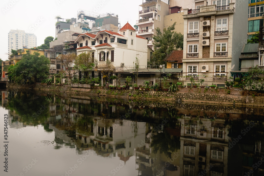 Traditional vietnamese houses and reflection  in Hanoi, Vietnam