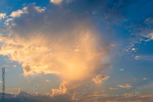 blue sky with golden orange cloud sunset