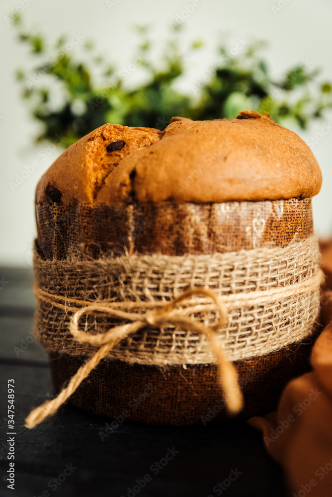 Fresh baked panettone on a wooden table