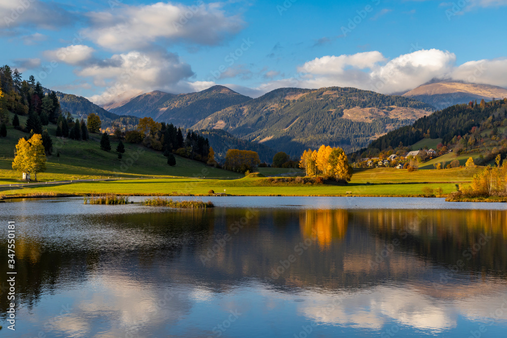 autumn pond under the mountains, Murau district,.Styria, Austria