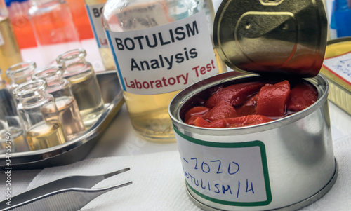  Several samples of red peppers from a canned food can, botulism infection in sick people, conceptual image photo