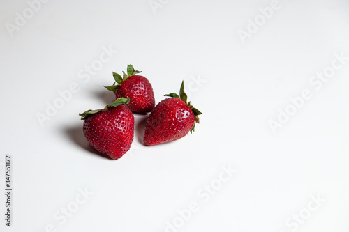 strawberries on a white table