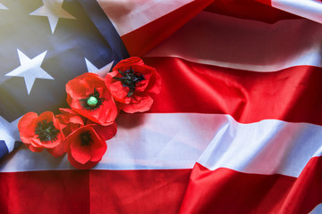 American flag and a poppy flowers with Memorial Day Remember and Honor text background