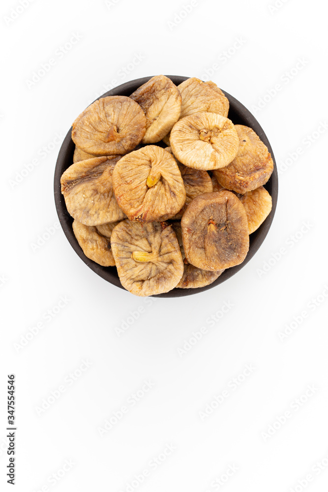 Dried apricots in round bowl on white background, top view Dried apricots in round bowl on white background, top view