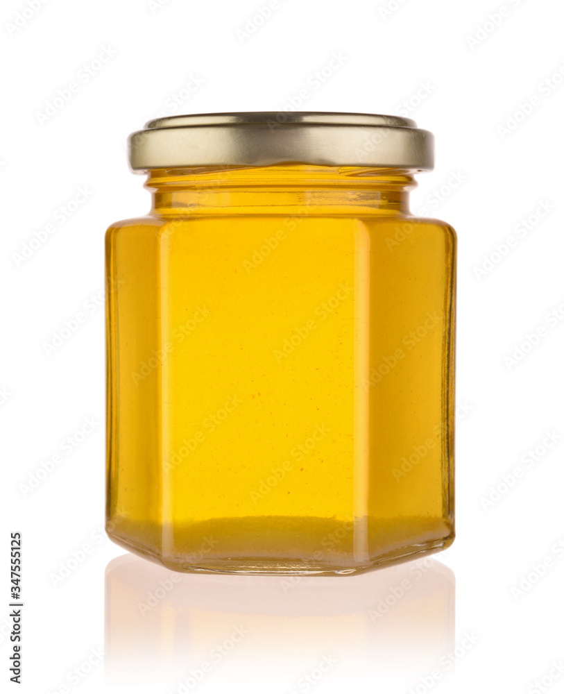 Fresh honey in a glass jar isolated. Fresh honey in a glass jar isolated.