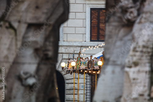 Ancient German Horse Carousel built in 1896 in Navona Square, Rome, Italy