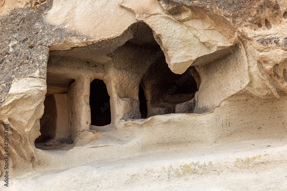 Cave in the rocks in the valley of Cappadocia. Close-up. Tourism and travel.