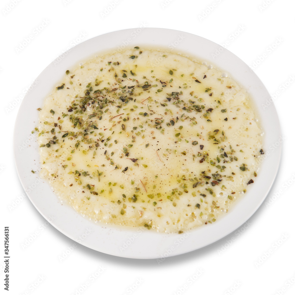 Grilled and melted provolone cheese with oregano Grilled and melted provolone cheese with oregano