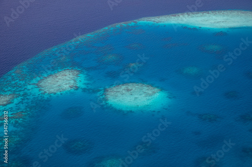 Tropical islands and atolls in Maldives from aerial view. Maldives consist of many islands and atolls which are the world top beauty.