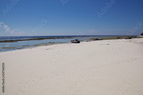 low tide with boats on a tropical island