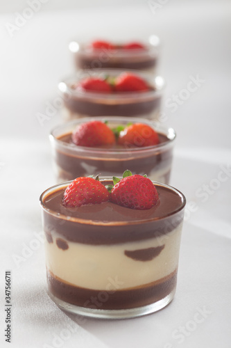 Chocolate dessert with layered mascarpone, decorated with strawberries.