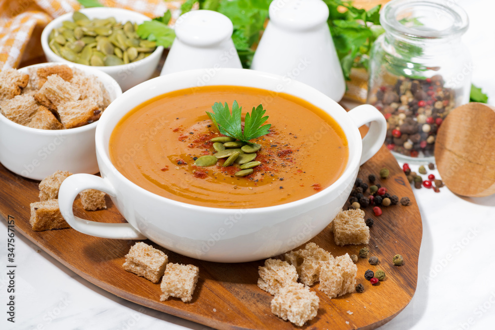 soup of pumpkin and lentils and ingredients on wooden board soup of pumpkin and lentils and ingredients on wooden board