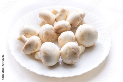 on a white plate are mushrooms champignons,