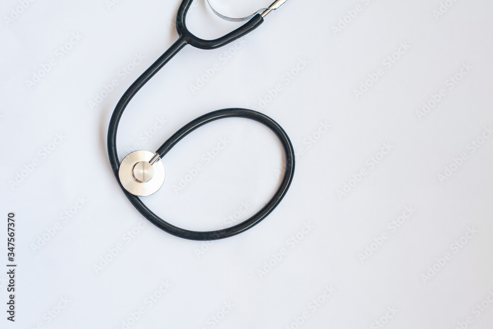 stethoscope and blue medical mask on a white background stethoscope and blue medical mask on a white background