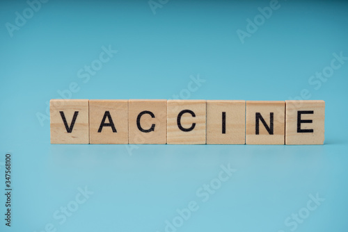 Vaccine infection concept. Letter of wooden blocks