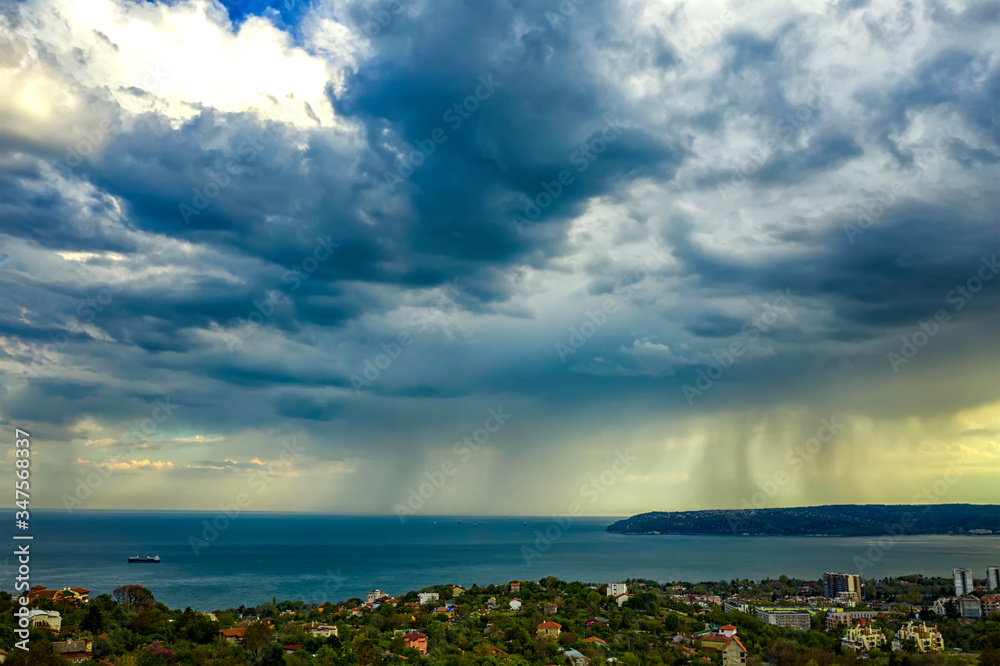 exciting stormy clouds and rain over the sea exciting stormy clouds and rain over the sea