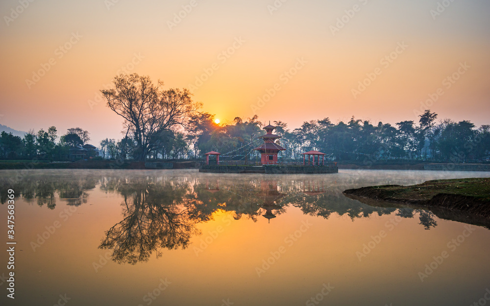 Temple in the middle of a lake during sunrise