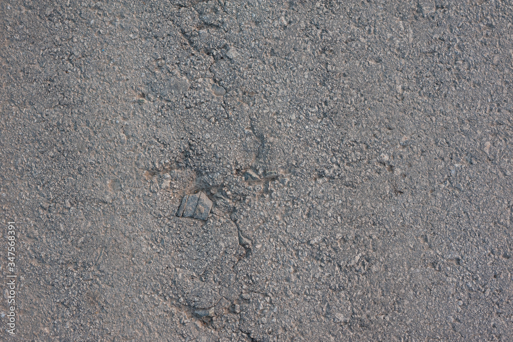 texture of old gray asphalt with a crack texture of old gray asphalt with a crack