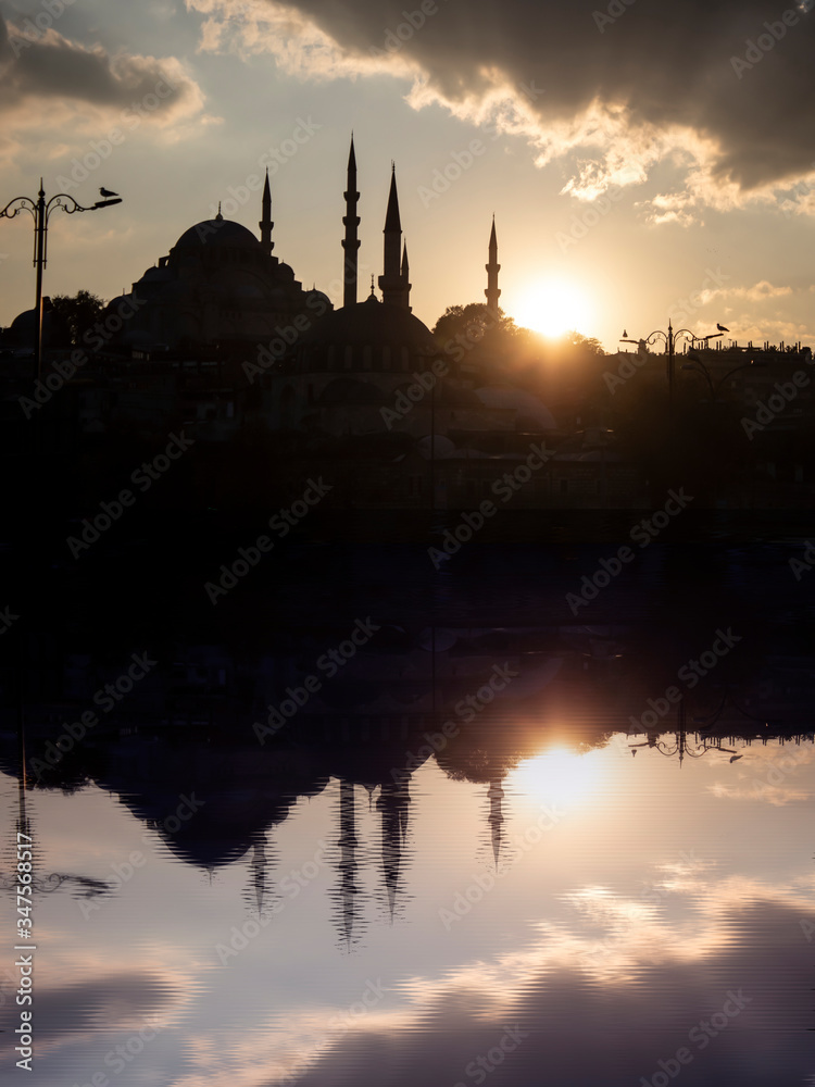 Suleymaniye mosque in Istanbul, Turkey, at sunset with a reflection. Close up.