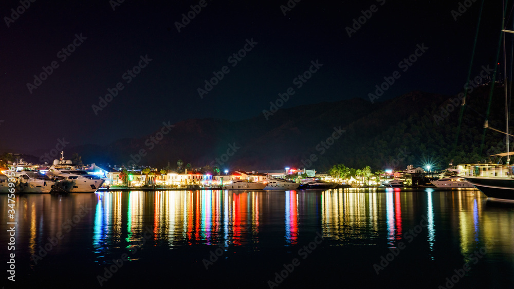 reflection in the sea of ​​night lights of the city of Marmaris