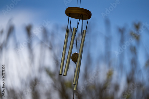Quadro su tela Wind Chimes blowing in the summer air