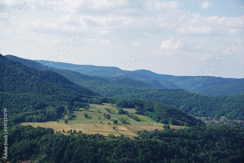 View over fields in the hilly terrain of Palatinate forest