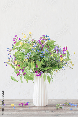 Fototapeta Naklejka Na Ścianę i Meble -  summer wild flowers in vase on white background