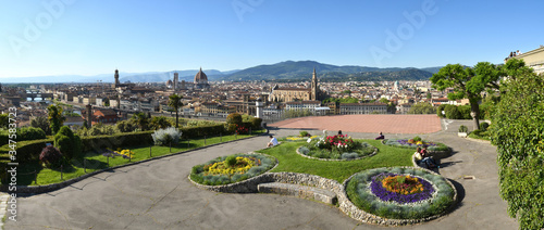 Gardens at Piazzale Michelangelo in Florence and the Skyline of the City. From Left to Right, Old Bridge, Cathedral of Santa Maria del Fiore and Basilica of the Holy Cross. Italy. photo