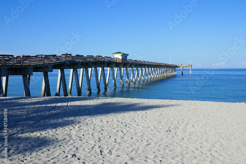 Pier from the beach over the ocean