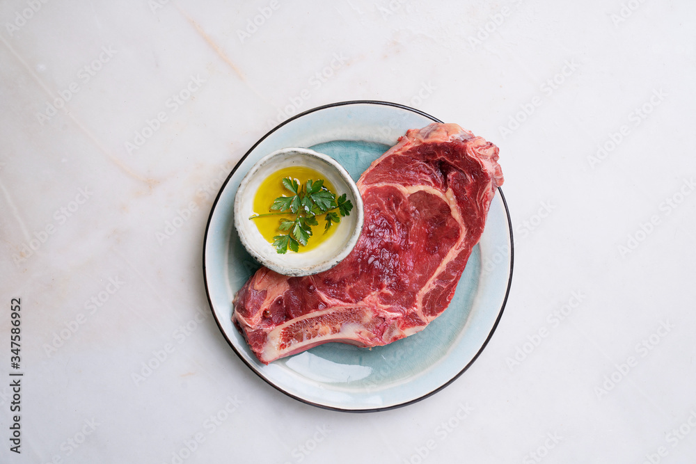 Raw fresh beef steak on the bone