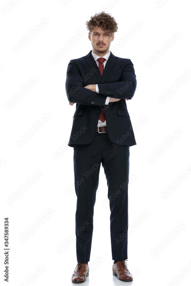 Upset businessman holding arms crossed at his chest Upset businessman holding arms crossed at his chest