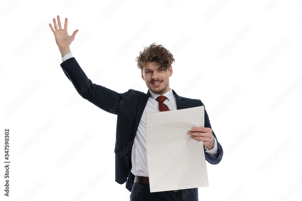 Happy businessman holding newspaper and hand in the air Happy businessman holding newspaper and hand in the air